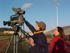 Setting up a camera to cover a high school sporting event in 2002